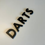 Schriftzug 3D aus Holz "DARTS"
